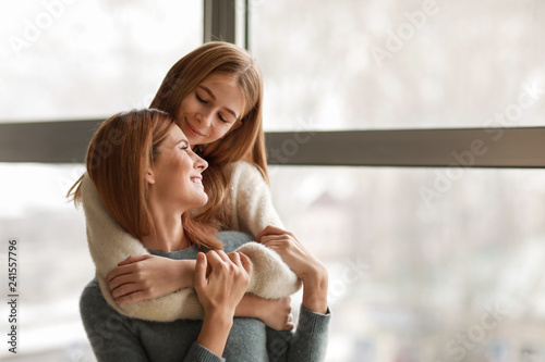 Portrait of happy mother an...