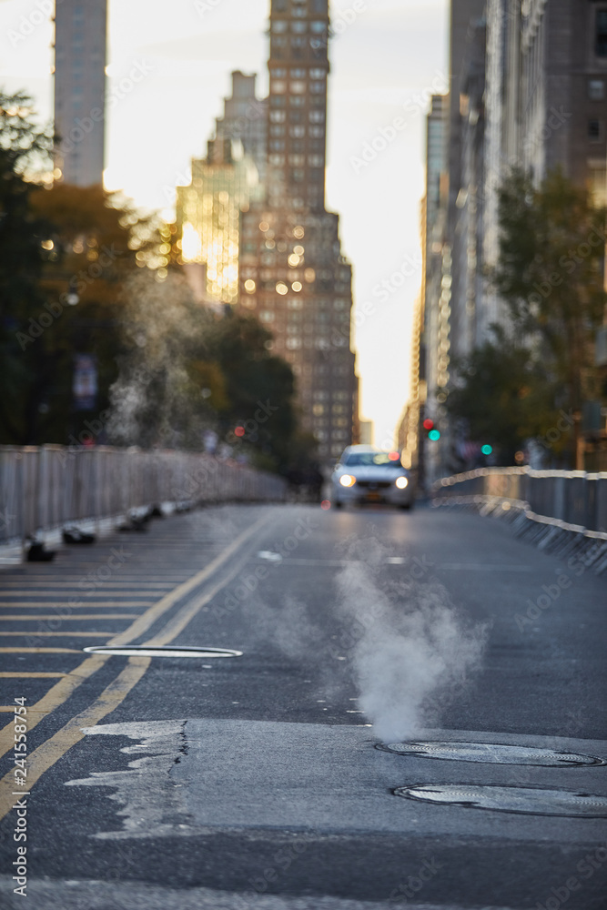 Smoke in the street of New York with car on background