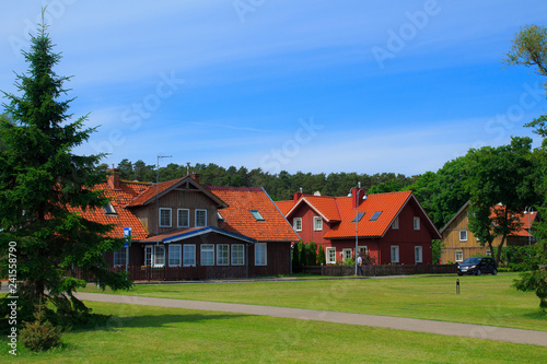Traditional Lithuanian wooden and half-timber houses in the countryside. Juodkrante village,