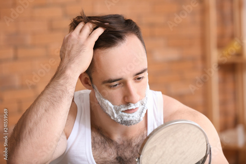 Handsome man with shaving f...