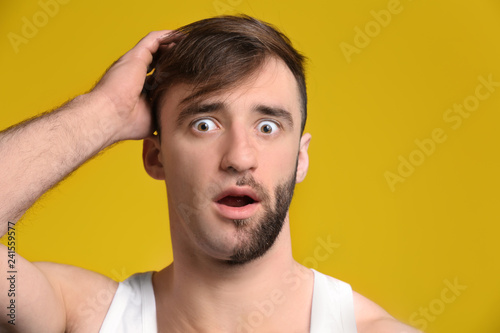Shocked man having half of ...