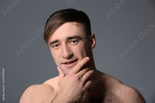Handsome shaved man against...