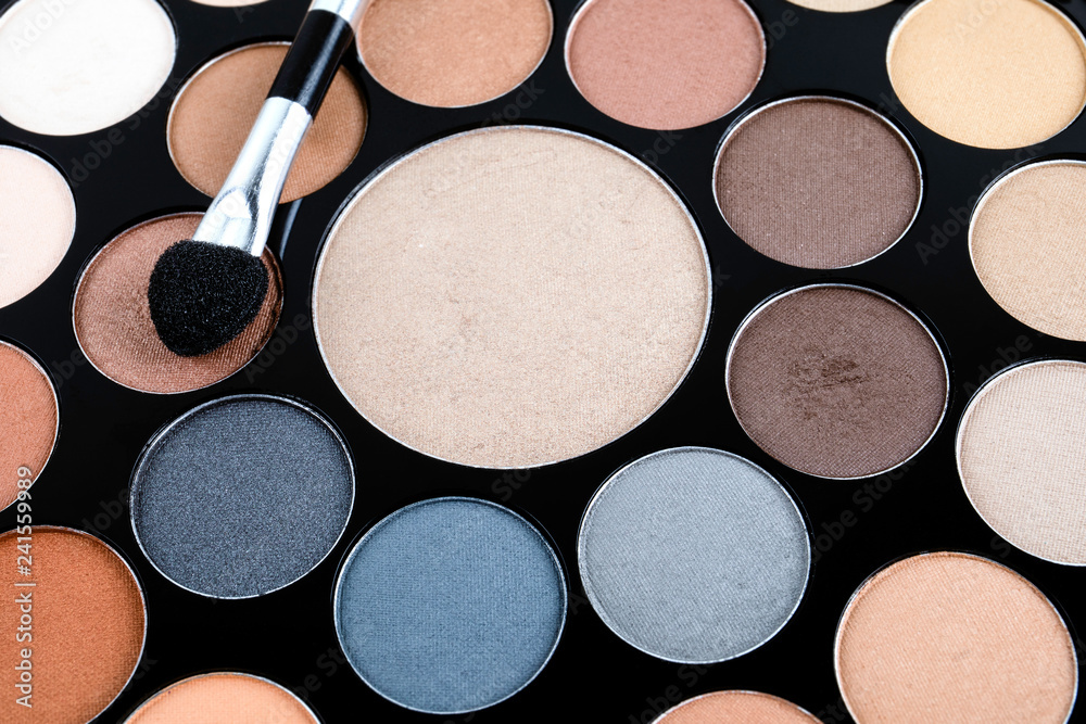 Palette of cosmetic eye shadow for make-up. Fashion and beauty background