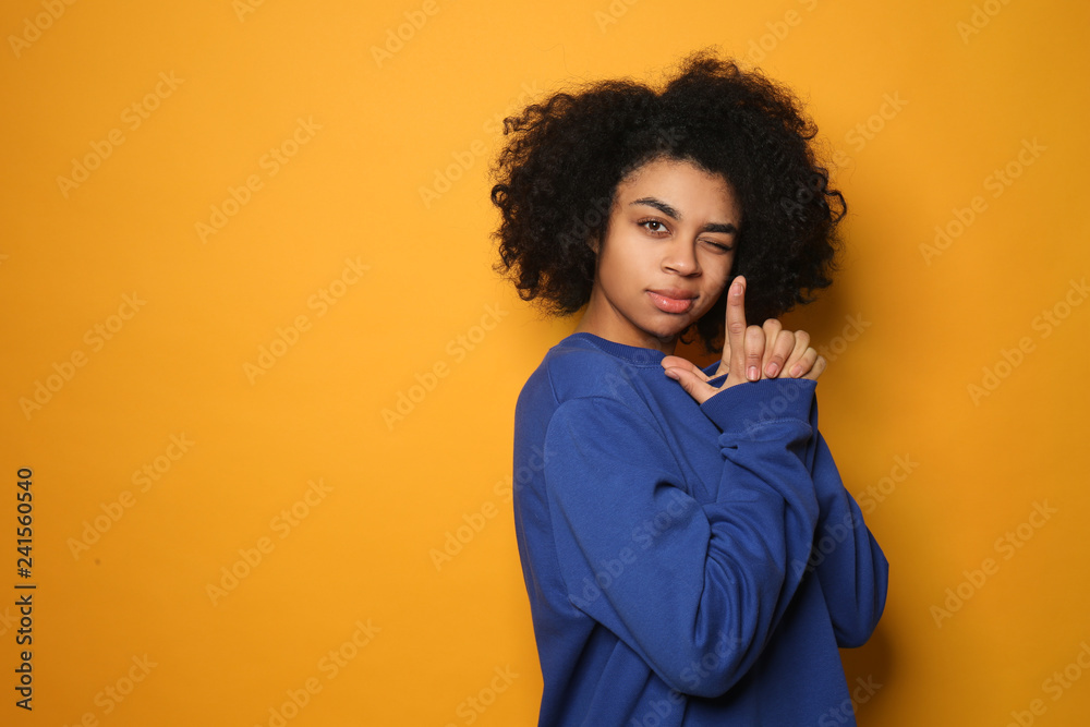 Portrait of young African-American woman showing Portrait of young African-American woman showing