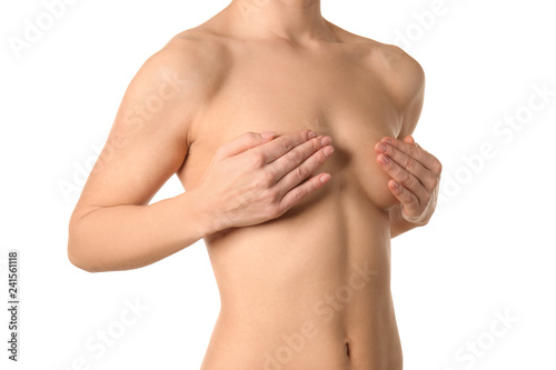 Naked woman on white background. Concept of breast augmentation