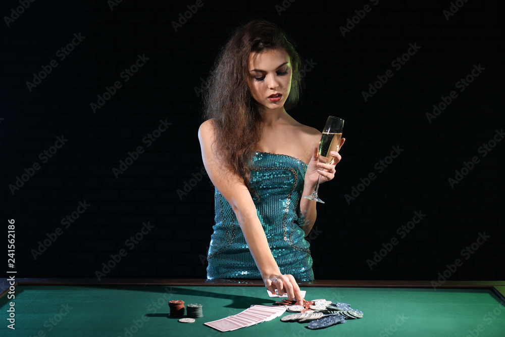 Beautiful female player at table in casino Beautiful female player at table in casino