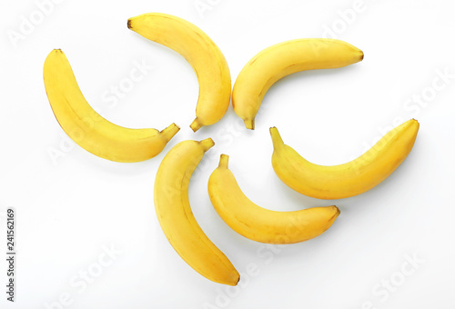 Ripe sweet bananas on white background