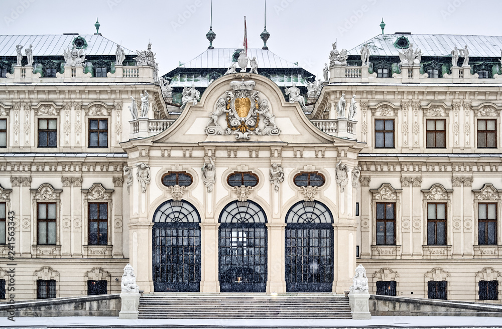 Detail close-up of the south front of Upper Belvedere Palace and art gallery in a winter blizzard snow storm, showing baroque design. Vienna, Austria.