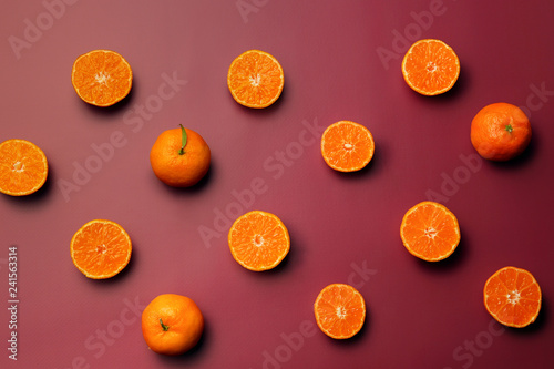Plenty of fresh tangerines on color background