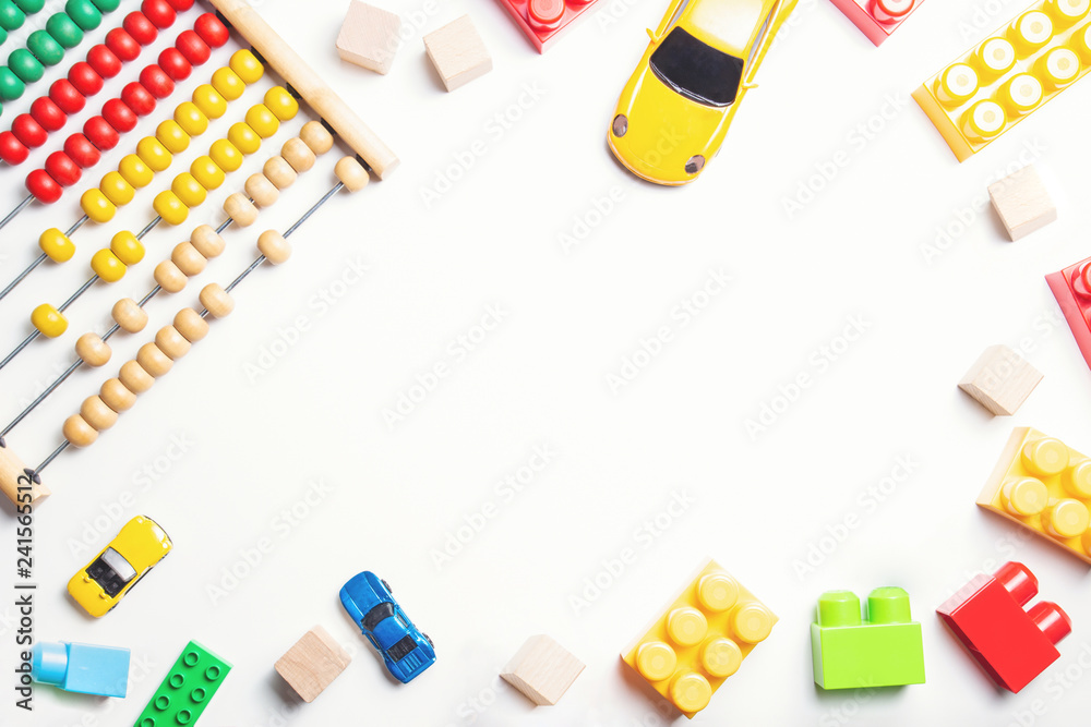 Baby kids toys frame on white background. Top view, flat lay Baby kids toys frame on white background. Top view, flat lay