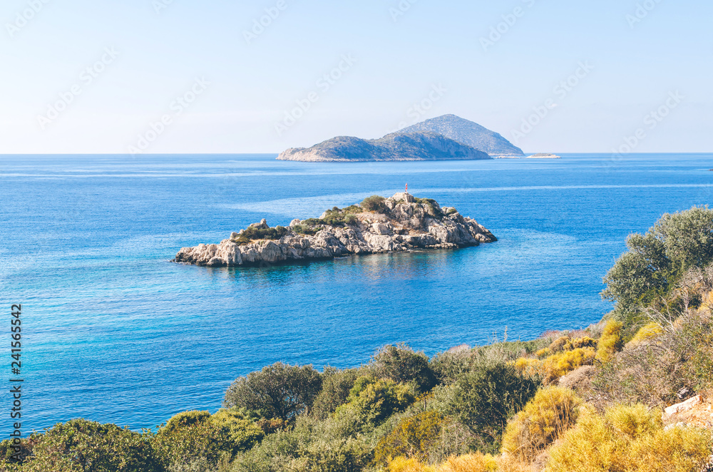 Small rocky island in Ufakdere, Kas, Antalya, Mediterranean coast of Turkey