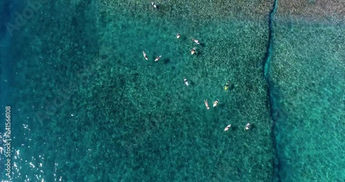 surfing in aerial view, teahupoo papeete french polynesia photo