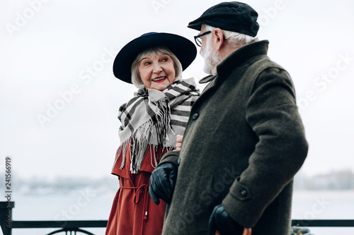 Amazing senior female person walking with her partner