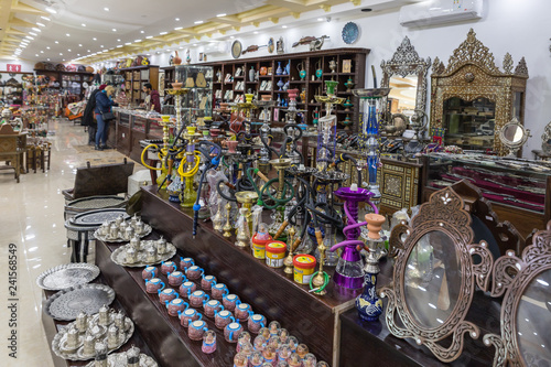 A large number of decoratively decorated hookahs and tobacco for them for sale in a roadside store near Maan city in Jordan photo