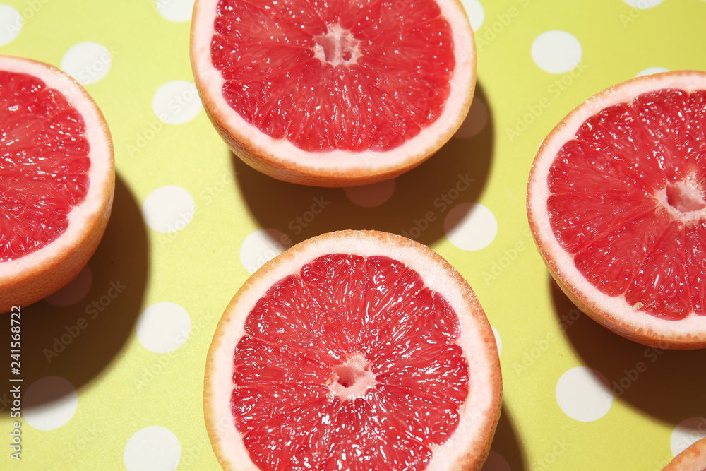 Pieces of juicy grapefruit on color background Pieces of juicy grapefruit on color background