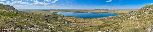 Beautiful summer steppe landscape and Ayr (Monastyri) Lake, located in stone mountains "Monasteries" and "Aiyrtau" (1003 meters above sea level), near the town of Ust-Kamenogorsk in East Kazakhstan