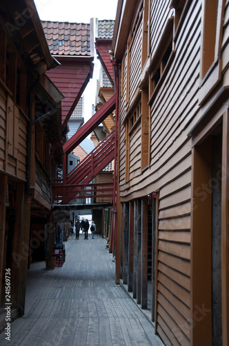 Narrow alley between old wooden houses