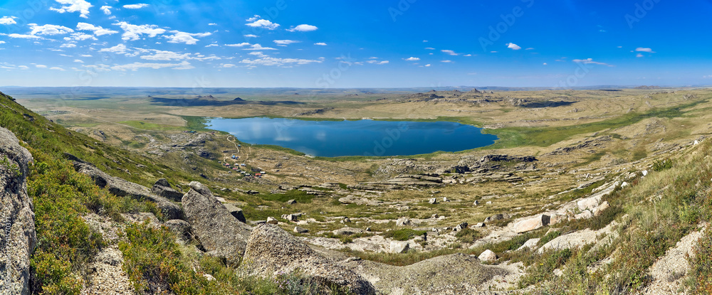 Beautiful summer steppe landscape and Ayr (Monastyri) Lake, located in stone mountains Beautiful summer steppe landscape and Ayr (Monastyri) Lake, located in stone mountains