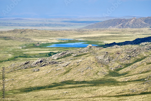 Beautiful summer steppe landscape and Ayr (Monastyri) Lake, located in stone mountains 