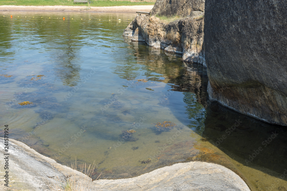 Fototapeta premium One of Stockholm's finest bathing beaches with, sandy beach, rocky bath, jumping tower and more