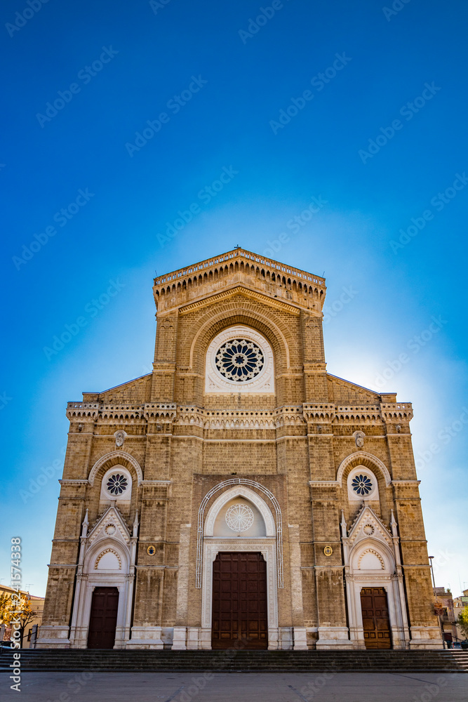 Cathedral of San Pietro Apostolo, also known as Duomo Tonti, by Paolo Tonti, who donated his wealth for its construction. Facade with rose windows and portals. Cerignola, Puglia, Italy.