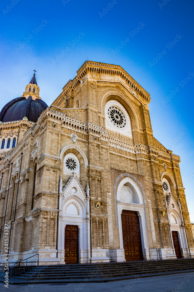 Cathedral of San Pietro Apostolo, also known as Duomo Tonti, by Paolo Tonti, who donated his wealth for its construction. Facade with rose windows, portals and dome. Cerignola, Puglia, Italy.