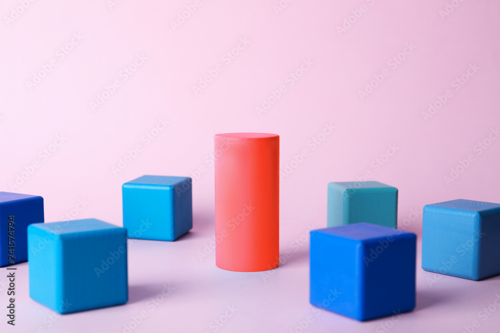 Different figure surrounded by cubes on color background Different figure surrounded by cubes on color background