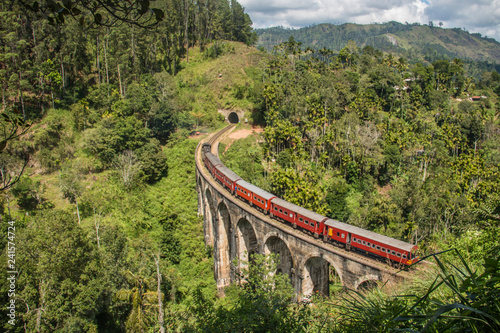 Iconic train driving over the Nine Arches Bridge in Ella, Sri Lanka