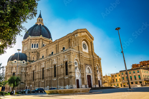 Cathedral of San Pietro Apostolo, also known as Duomo Tonti, by Paolo Tonti, who donated his wealth for its construction. Facade, rose windows, portals, dome and fountain. Cerignola, Puglia, Italy. photo