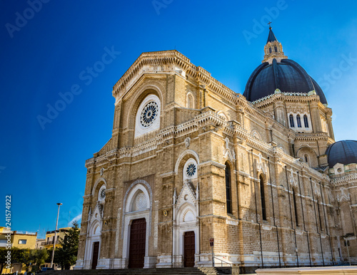 Cathedral of San Pietro Apostolo, also known as Duomo Tonti, by Paolo Tonti, who donated his wealth for its construction. Facade, rose windows, portals, dome and apse. Cerignola, Puglia, Italy.