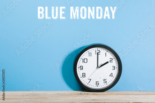 Blue Monday words on blue colored background with clock