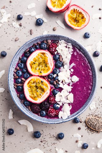 Smoothie acai bowl served in bowl on grey table