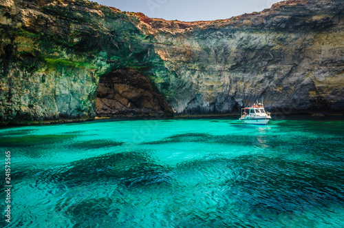 Blue Lagoon, Malta - the caves of the Blue Lagoon on the island of Comino on a bright sunny summer day with blue sky photo