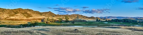 Beautiful landscape of steppe and stone mountains along the road from the city of Ust-Kamenogorsk to the Sibiny lakes (RU: Sibinskiye Ozora: Sadyrkol, Tortkara, Shalkar, Korzhynkol), East Kazakhstan