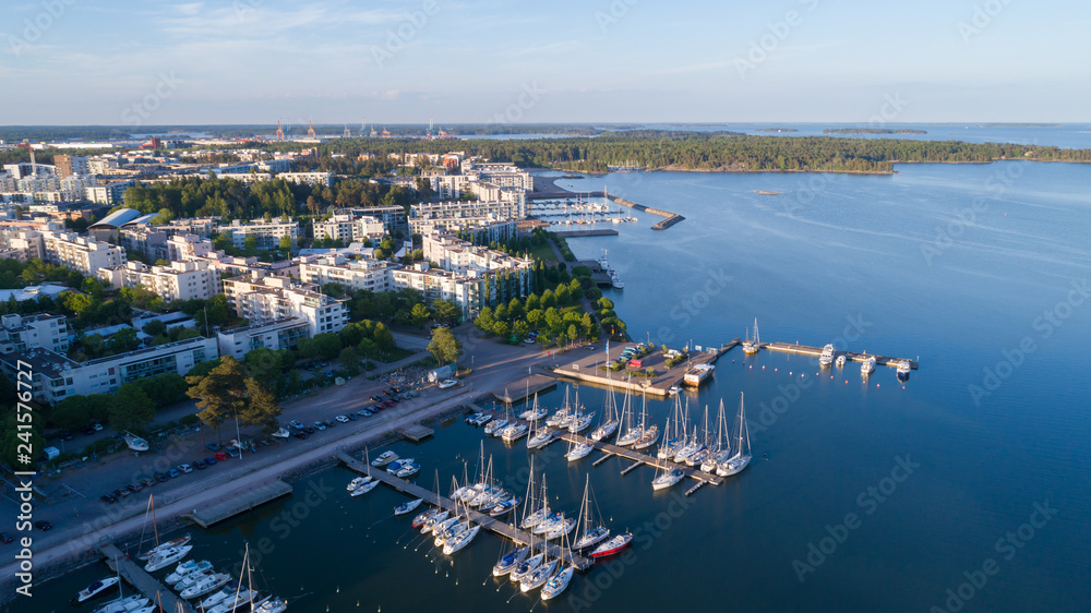 Beautiful view of harbor and boats. Helsinki city at sunset. Summer panorama.