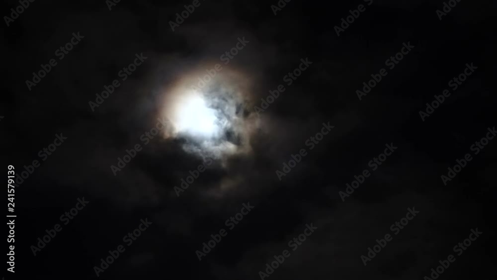 Many steps of fast moving clouds on the moon, almost hiding it and revealing it blinding as sun. Many steps of fast moving clouds on the moon, almost hiding it and revealing it blinding as sun.