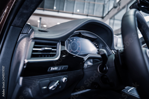 Close up of wheel inside new modern car with leather interior © Viacheslav Yakobchuk