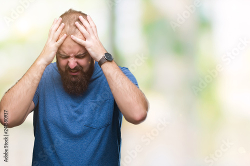 Young caucasian hipster man over isolated background suffering from headache desperate and stressed because pain and migraine. Hands on head.