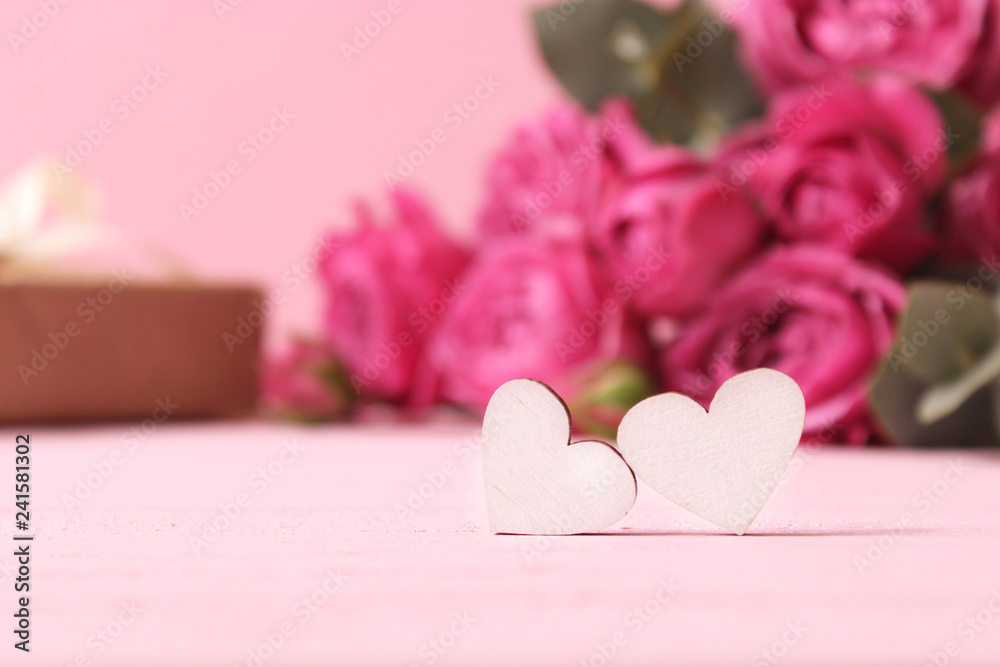 hearts on blurred background of flowers. Background to the day of Saint Valentine. hearts on blurred background of flowers. Background to the day of Saint Valentine.