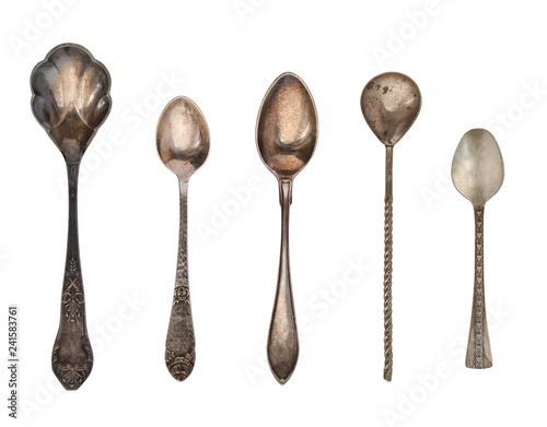 Vintage tea spoons and forks isolated on a white background. Retro silverware