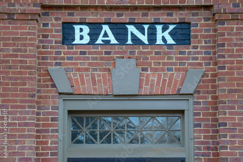 old brick bank building with painted sign