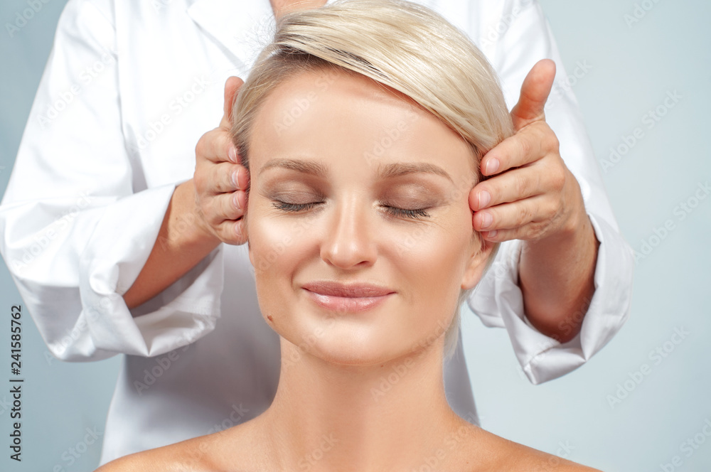 Beauty and face massage. Beautiful woman with clean perfect skin Beauty and face massage. Beautiful woman with clean perfect skin