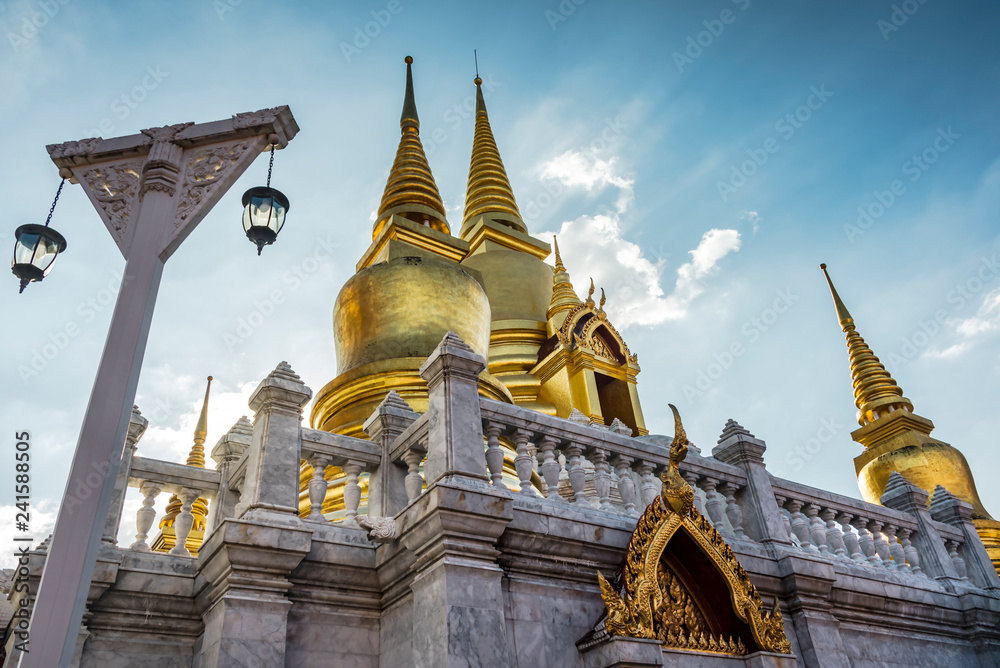 Naklejka premium Side view of golden pagoda in thailand