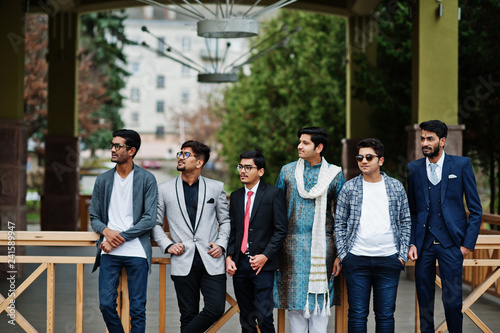Group of six south asian indian mans in traditional, casual and business wear.