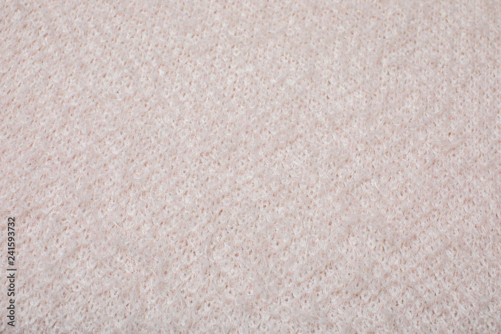 Fototapeta premium pink knitted texture, top view.