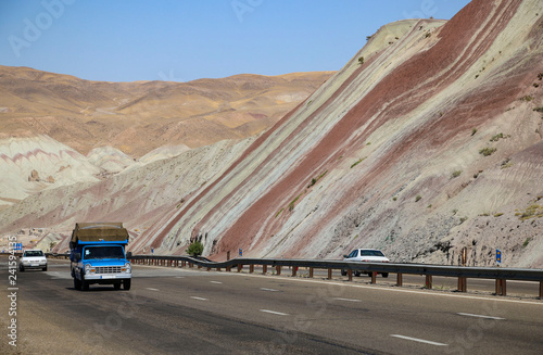Cars driving on the highway through beautiful colorful mountains in Tabriz, Iran © Mauritius71