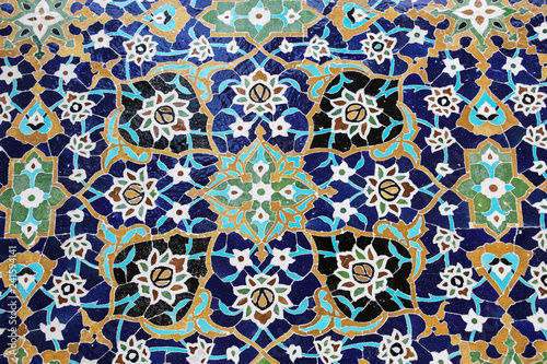Colorful mosaic and ceramic tiles in the traditional Persian style on the wall Tomb of Sheikh Safi al-Din, Ardabil, Iran.