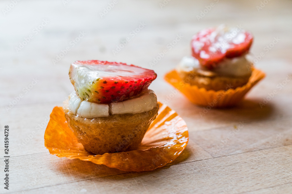 Mini Tarts, Tartolet or Tartlets with Strawberry, Cream and fresh fruits Mini Tarts, Tartolet or Tartlets with Strawberry, Cream and fresh fruits