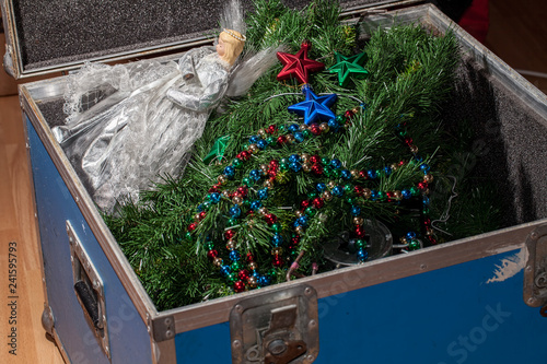 Christmas tree decorations taken down and packed away in storage.