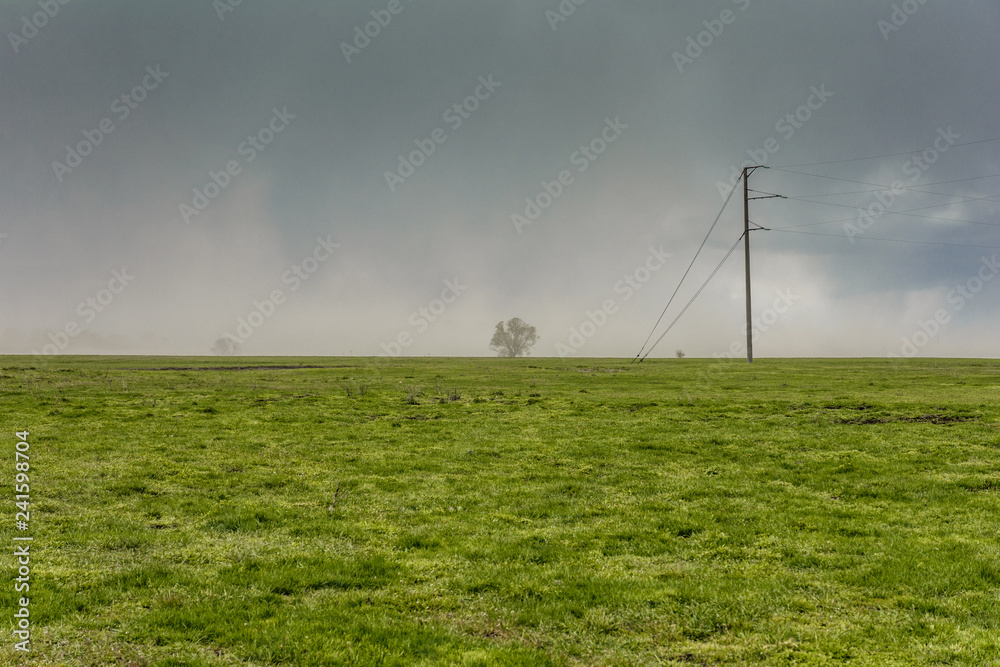 Spring in the village. Sowing works are conducted on the fields. Spring in the village. Sowing works are conducted on the fields.